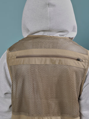 men's biege zippered cargo vest with utility pockets and zip closure
trendy outfits for men