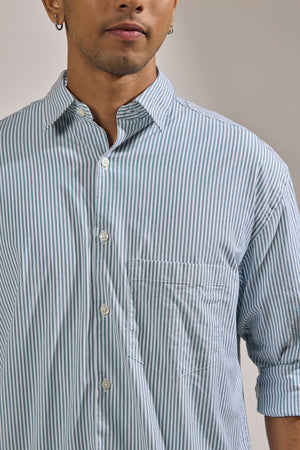 men's oversized cement green stripped shirt with full sleeve and chest pocket made from 100% cotton.
pure cotton shirts for men
oversized shirts for men