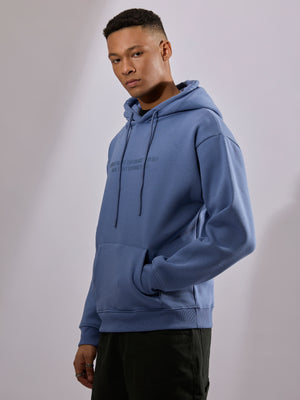 men's light blue long sleeve hoodie with minimal print, cotton and polyster blended.