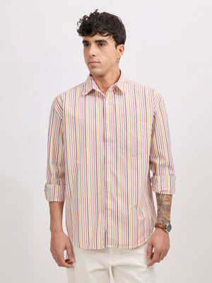 Man wearing a peach cotton oversized striped shirt with rolled sleeves, front pocket, and button-down collar
100% cotton