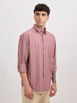 Man wearing a brick color cotton oversized striped shirt with rolled sleeves, front pocket, and button-down collar
100% cotton