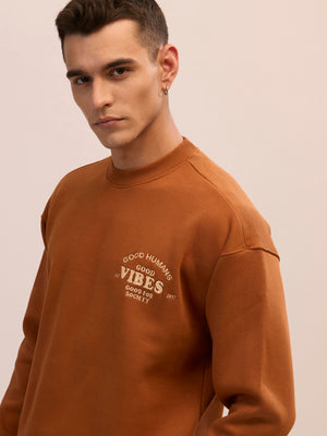 Men's brown full sleeve fleece sweater tee with front chest print and soft winterwear.