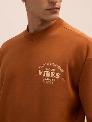 Men's brown full sleeve fleece sweater tee with front chest print and soft winterwear.