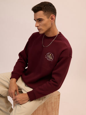 Men's maroon full sleeve fleece sweater tee with front chest print and soft winterwear.