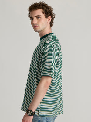 Man wearing a green and white striped crew t-shirt