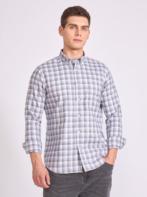 Man wearing a classic gray checkered shirt.