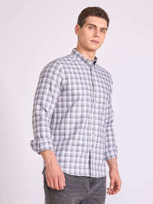 Man wearing a classic grey checkered shirt.