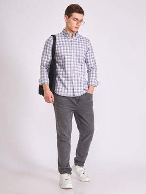 Man wearing a classic gray checkered shirt.