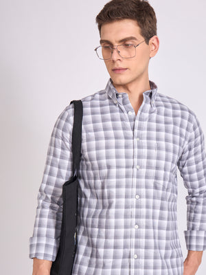 Man wearing a classic gray checkered shirt.