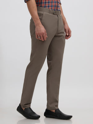 men's cement gray skinny fit trousers blended with polyster and spandex - paired with a black top and black shoes