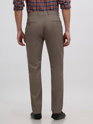 men's cement gray skinny fit trousers blended with polyster and spandex - paired with a black top and black shoes