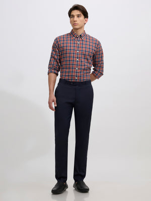 men's navy blue skinny fit trousers blended with polyster and spandex - paired with a black top and black shoes