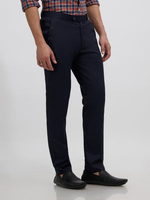 men's navy blue skinny fit trousers blended with polyster and spandex - paired with a black top and black shoes
