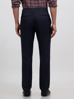 men's navy blue skinny fit trousers blended with polyster and spandex - paired with a black top and black shoes
