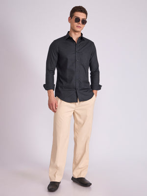 Man wearing a dark slate gray checkered shirt.