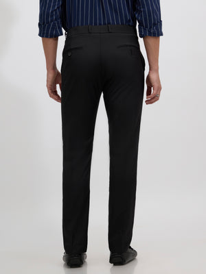 men's black skinny fit trousers blended with polyster and spandex - paired with a black top and black shoes