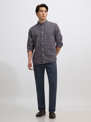 men's cement blue skinny fit trousers blended with polyster and spandex - paired with a black top and black shoes