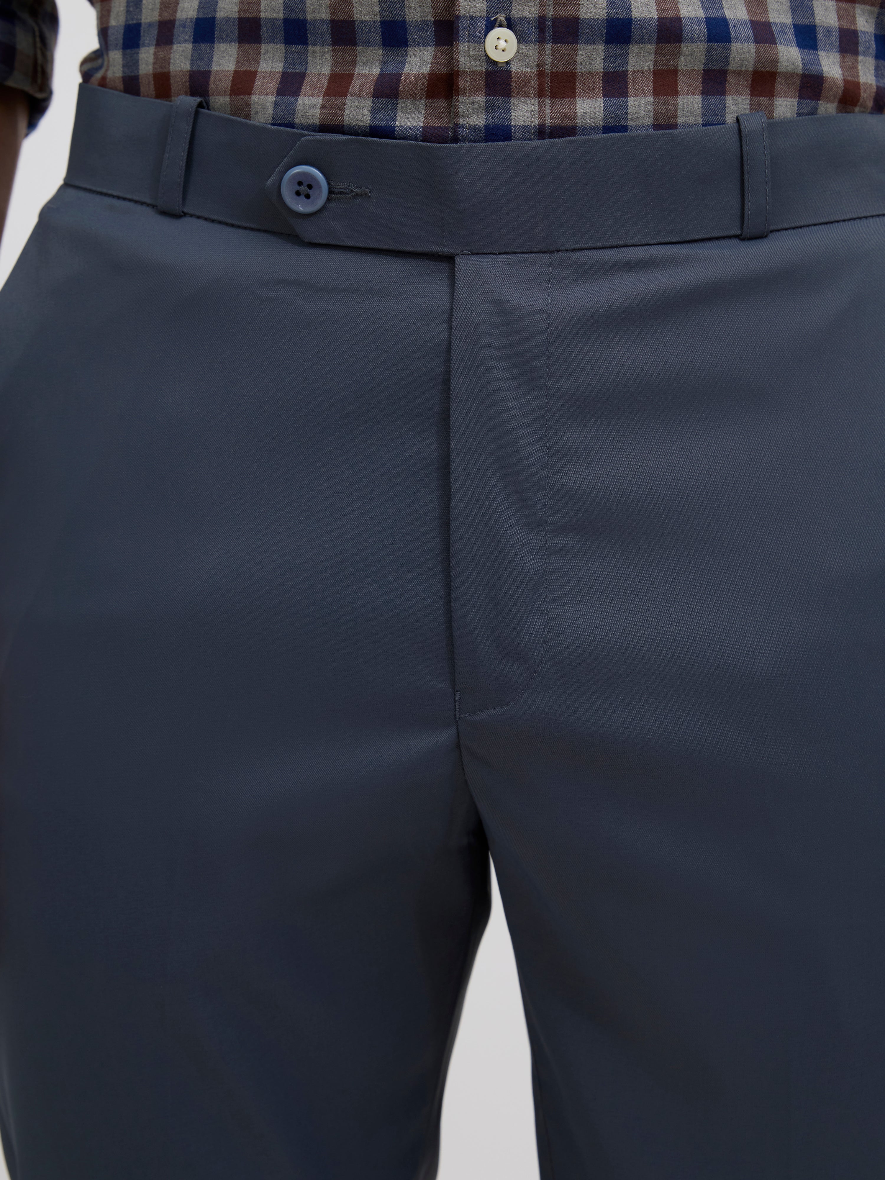 men's cement blue skinny fit trousers blended with polyster and spandex - paired with a black top and black shoes