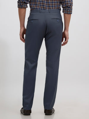 men's cement blue skinny fit trousers blended with polyster and spandex - paired with a black top and black shoes