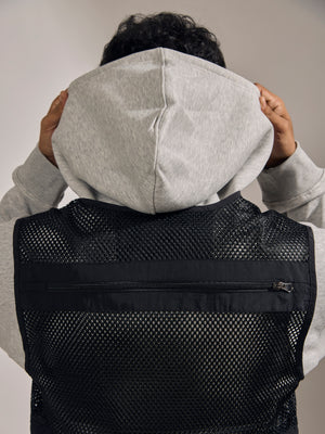 men's black zippered cargo vest with utility pockets and zip closure
trendy outfits for men