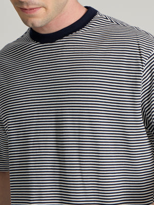 Man wearing a navy blue striped crew t-shirt