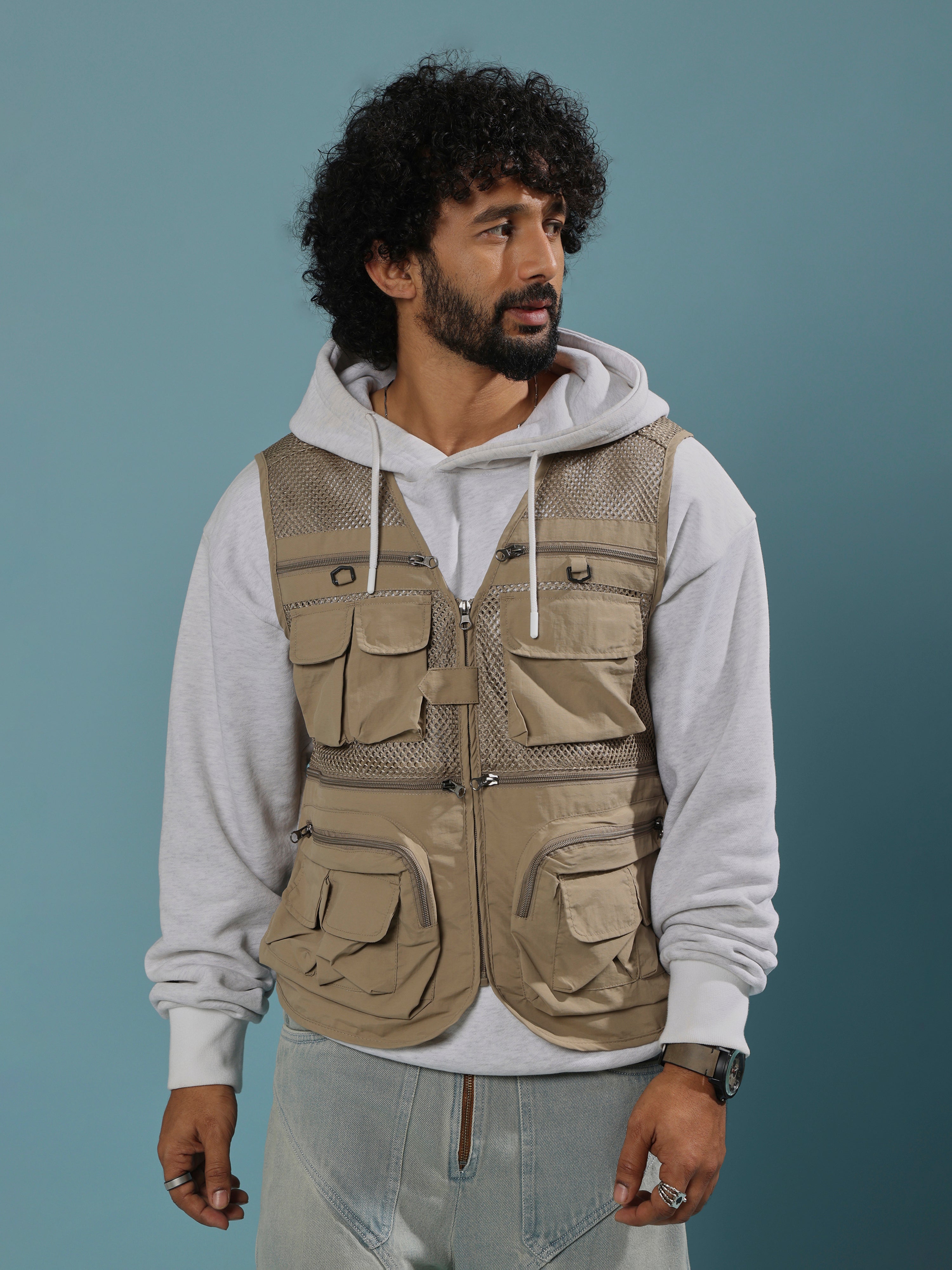 men's biege zippered cargo vest with utility pockets and zip closure.
trendy outfits for men