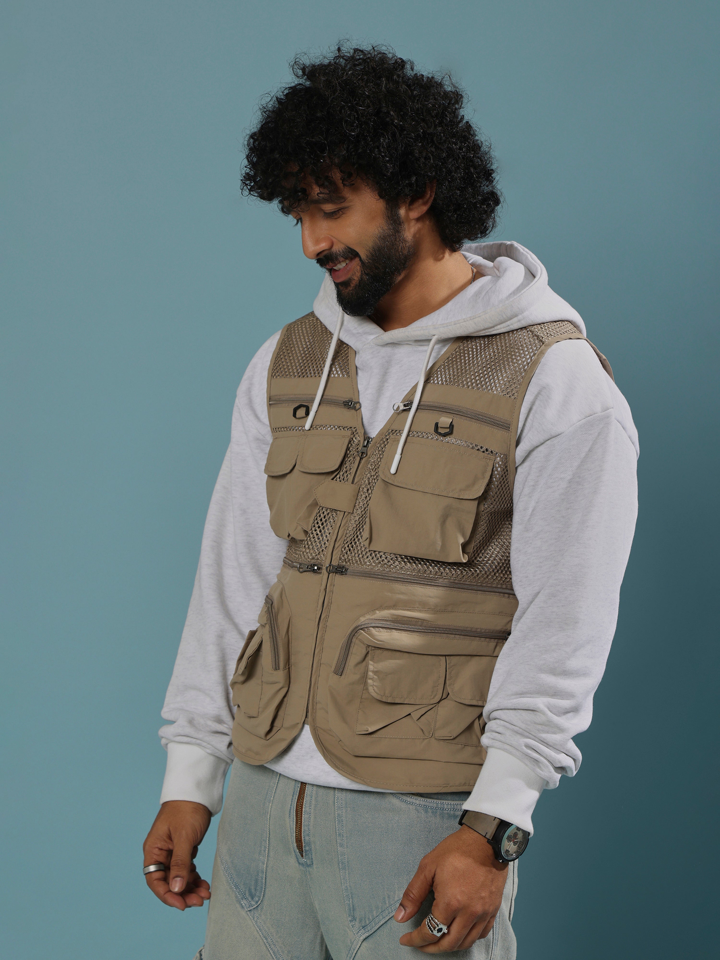 men's biege zippered cargo vest with utility pockets and zip closure
trendy outfits for men