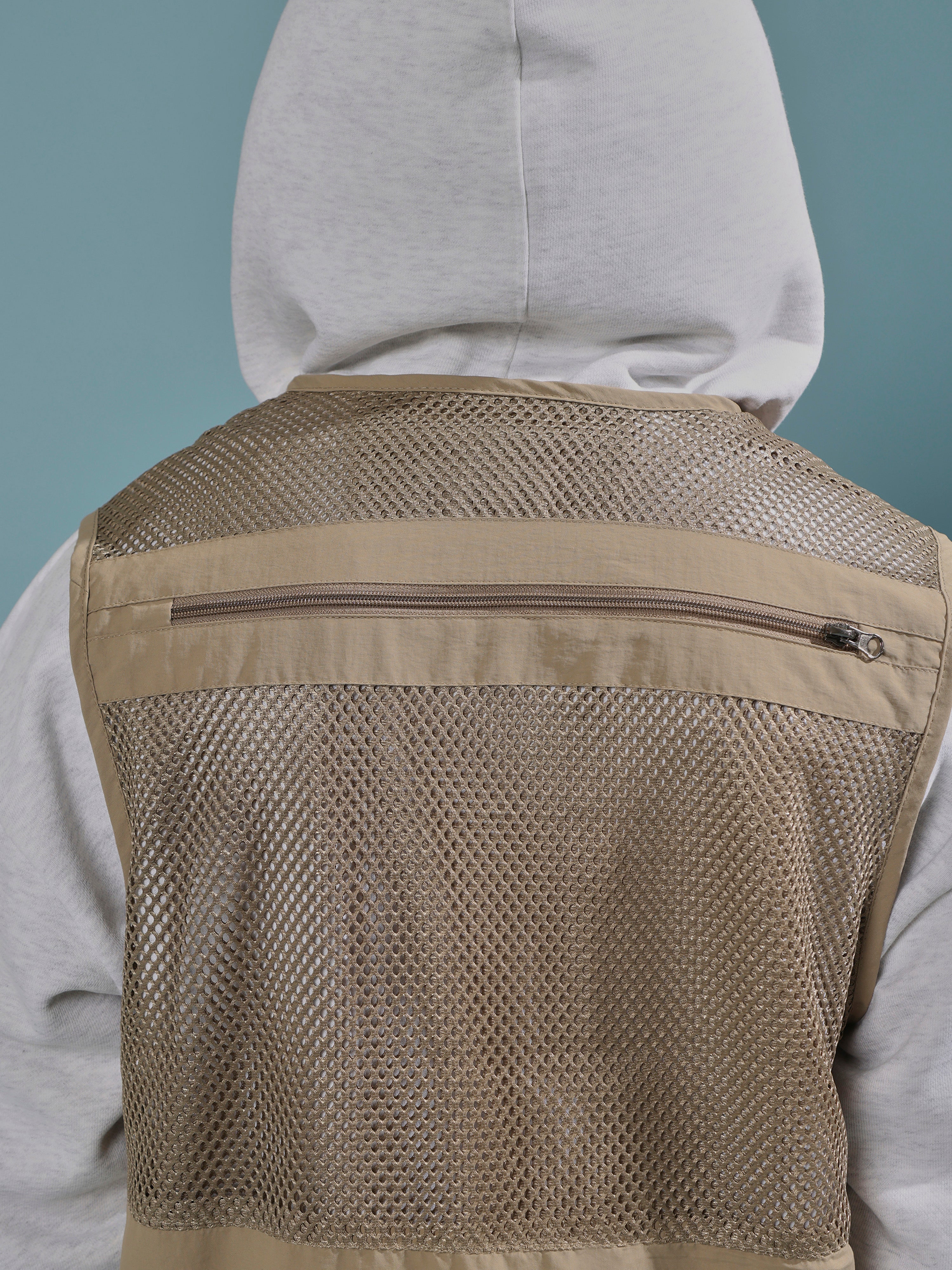 men's biege zippered cargo vest with utility pockets and zip closure
trendy outfits for men