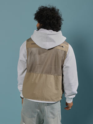 men's biege zippered cargo vest with utility pockets and zip closure
trendy outfits for men