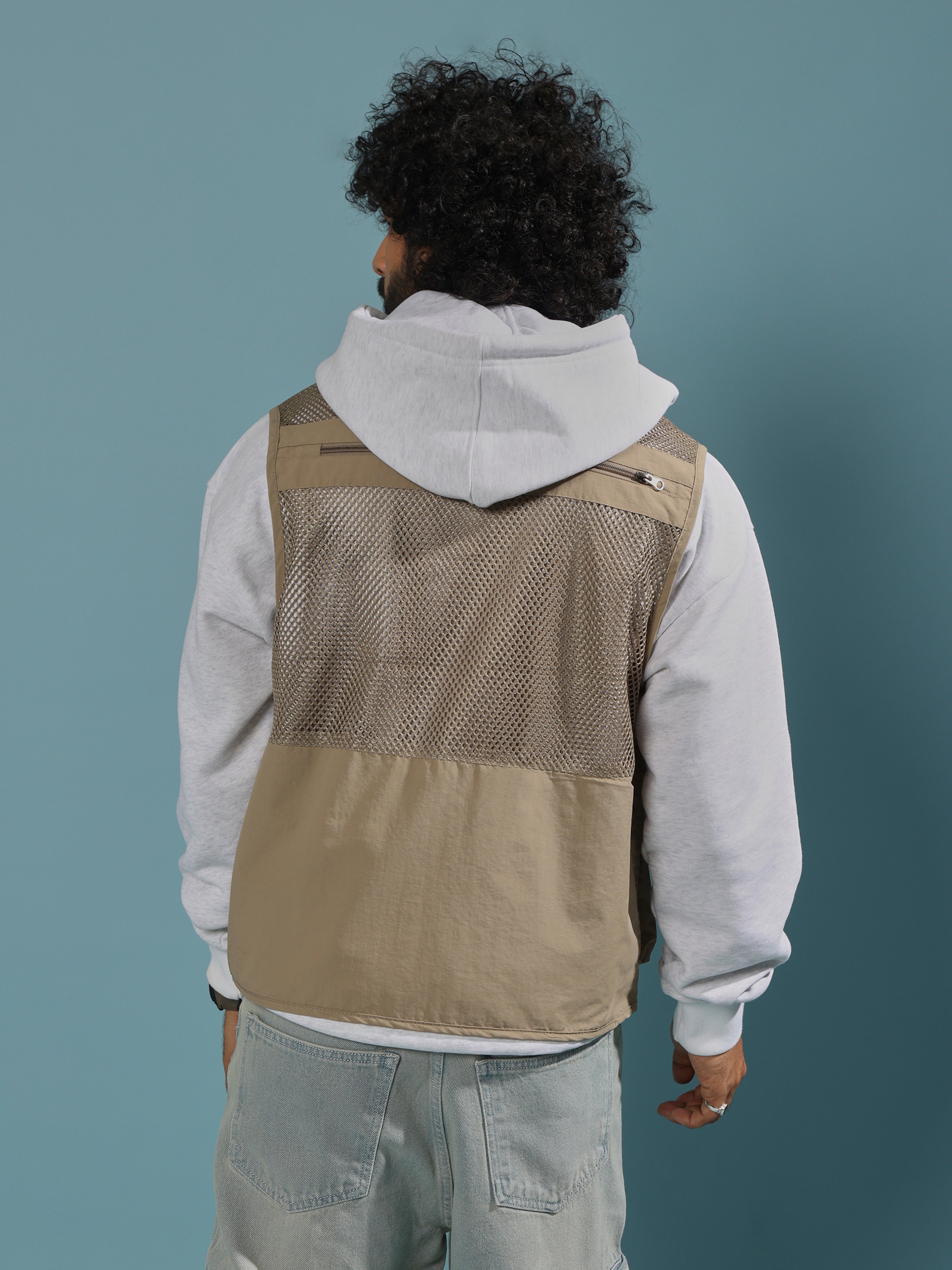 men's biege zippered cargo vest with utility pockets and zip closure
trendy outfits for men