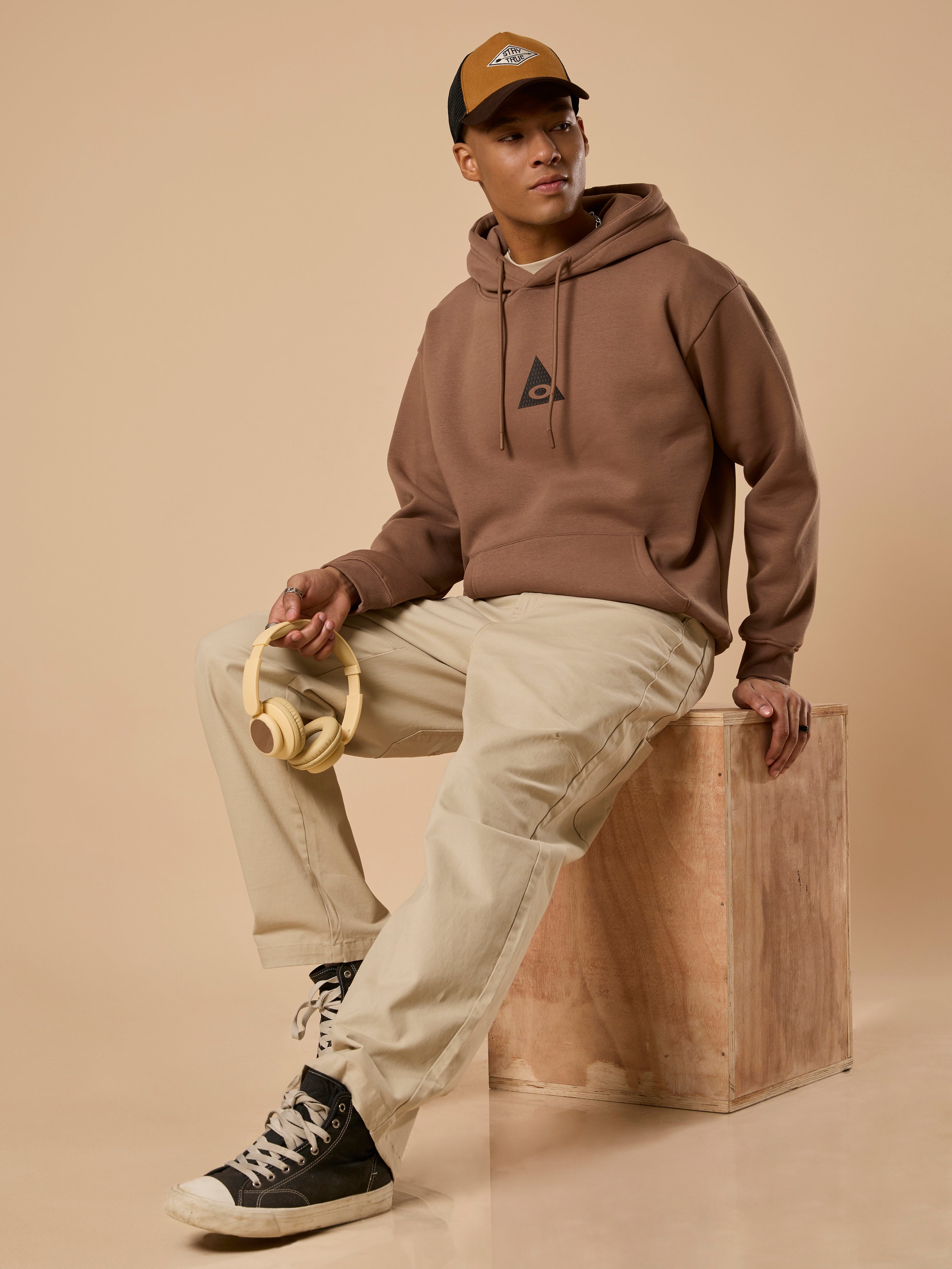 men's light brown long sleeve hoodie with minimal print, cotton and polyster blended.