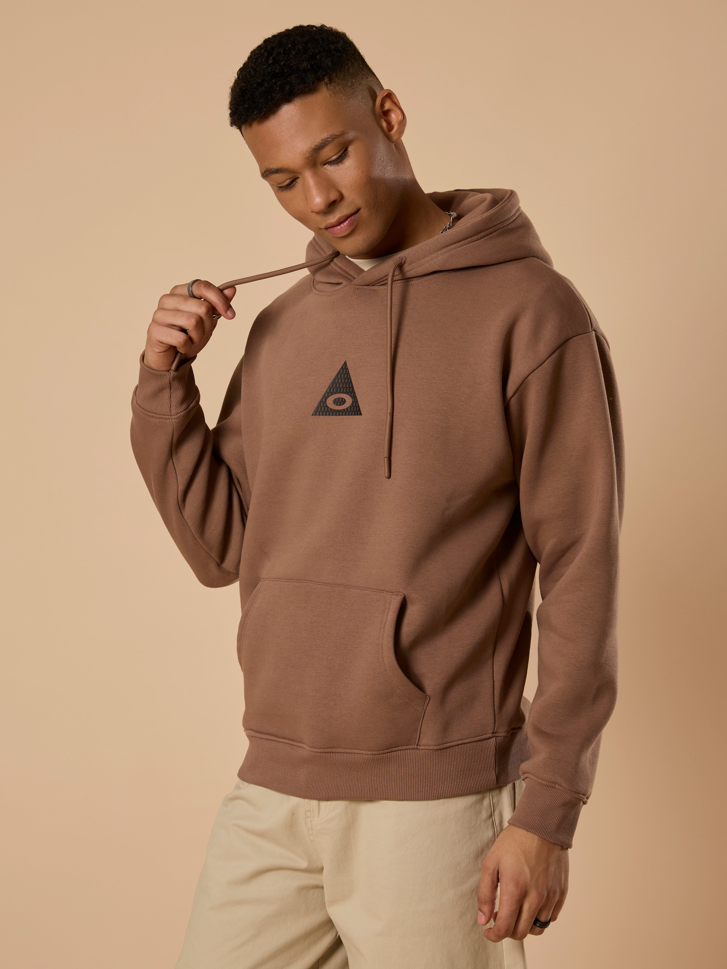 men's light brown long sleeve hoodie with minimal print, cotton and polyster blended.