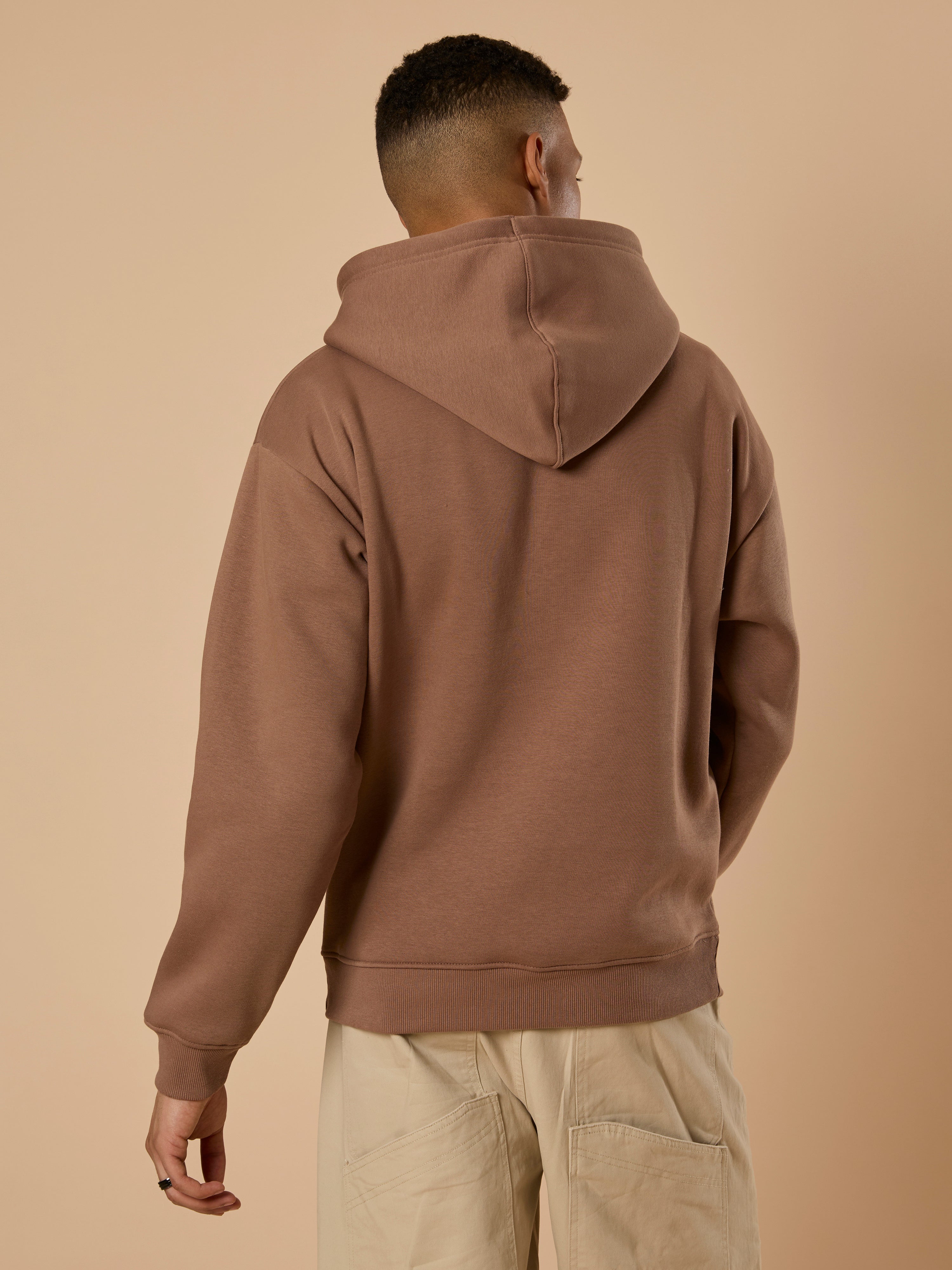 men's light brown long sleeve hoodie with minimal print, cotton and polyster blended.