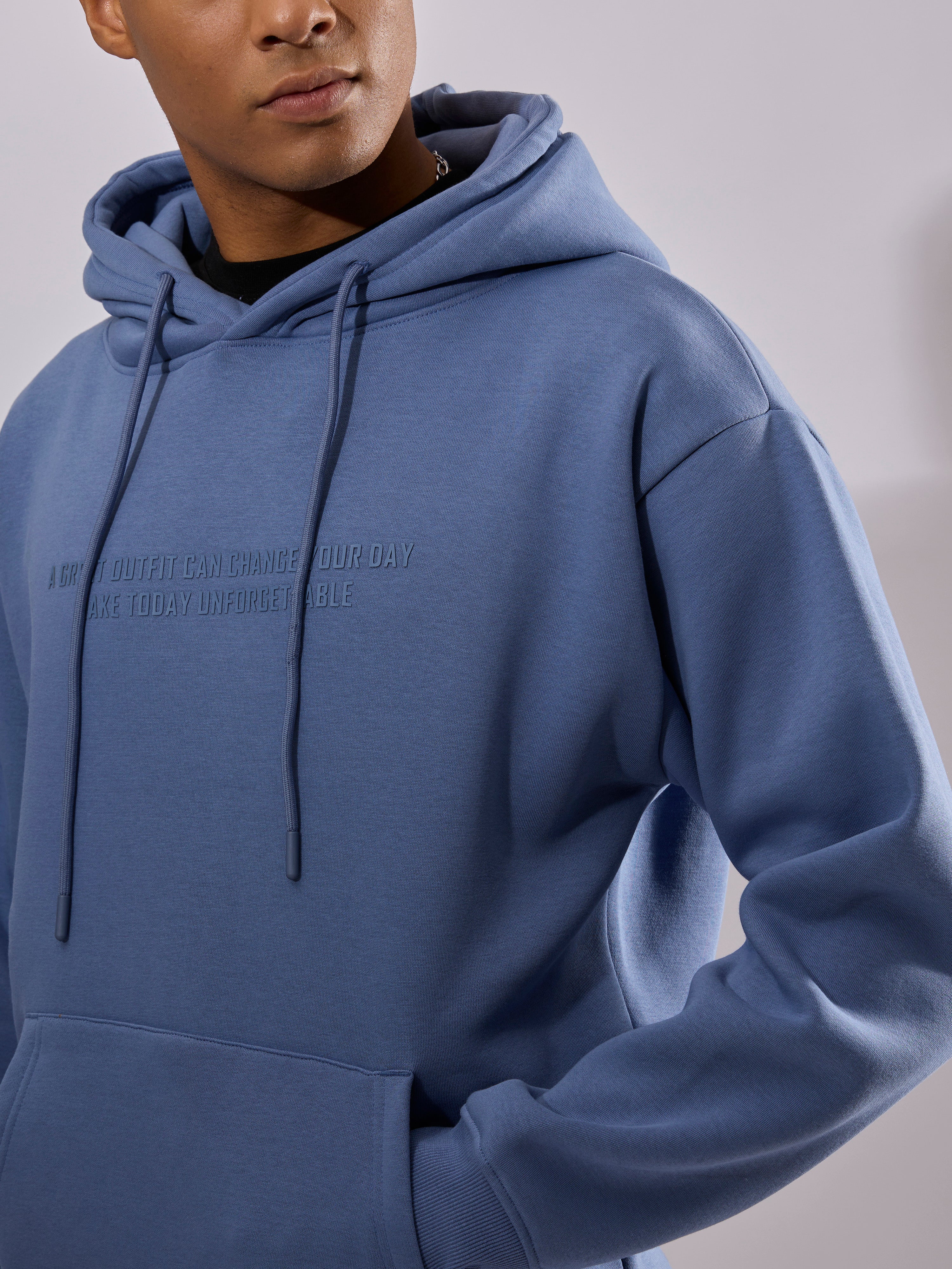 men's light blue long sleeve hoodie with minimal print, cotton and polyster blended.