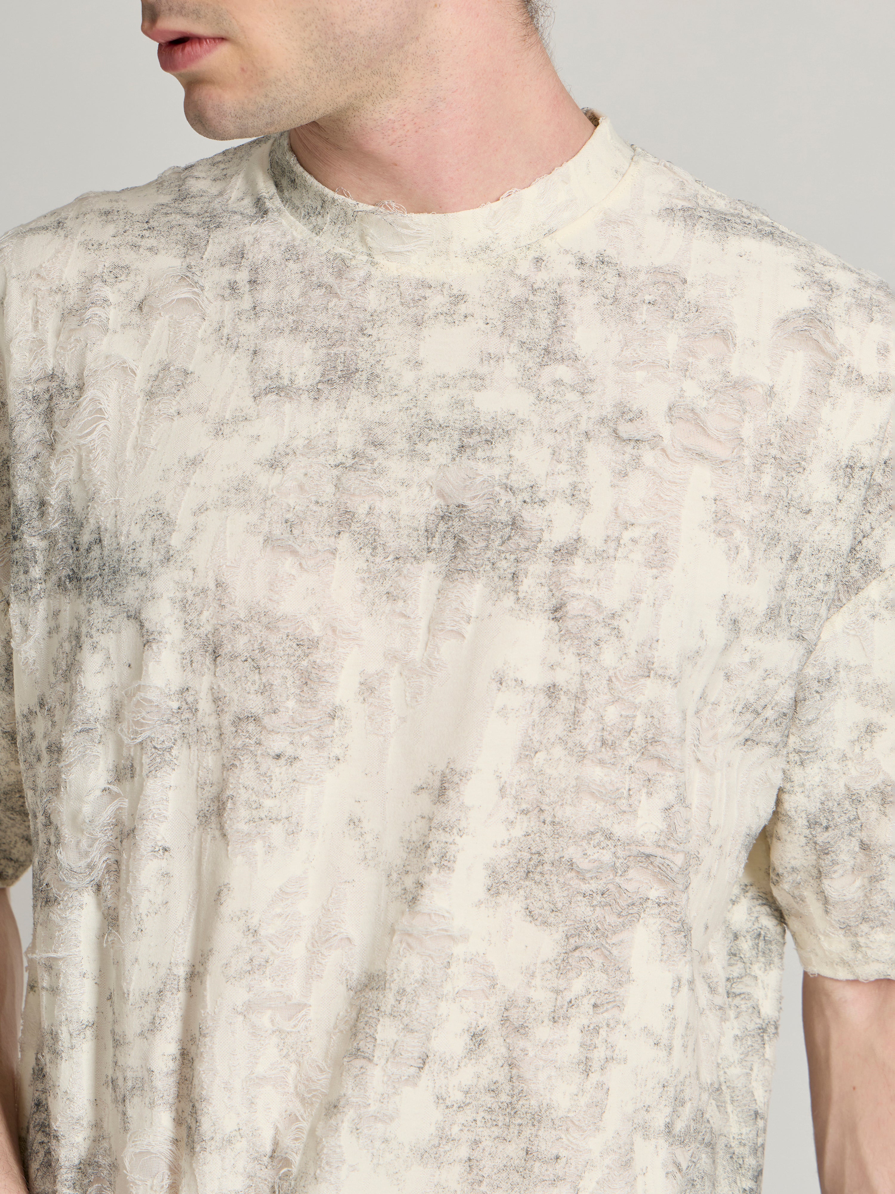 man wearing a Distressed Oversized T-Shirt - black