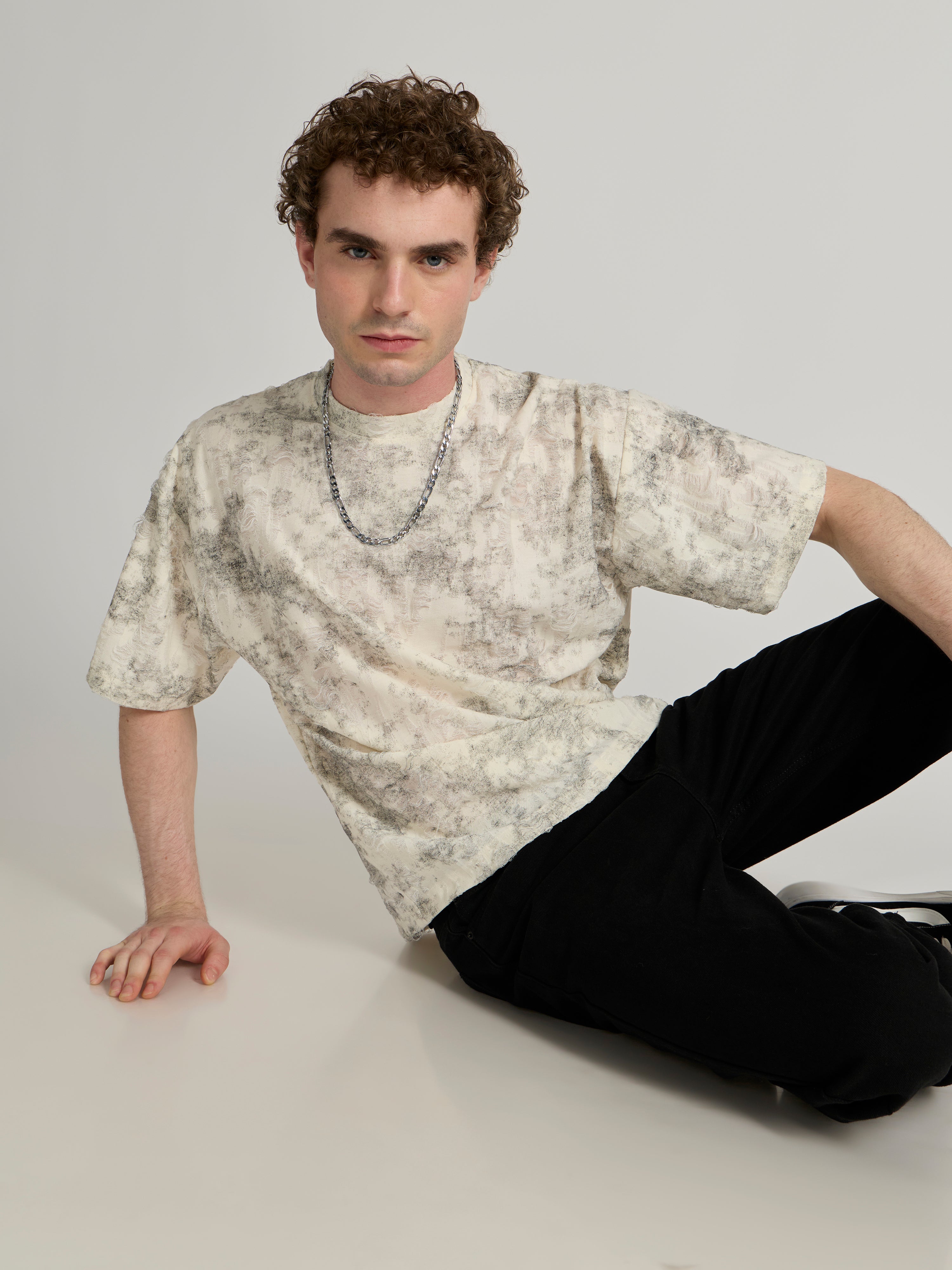 man wearing a Distressed Oversized T-Shirt - black