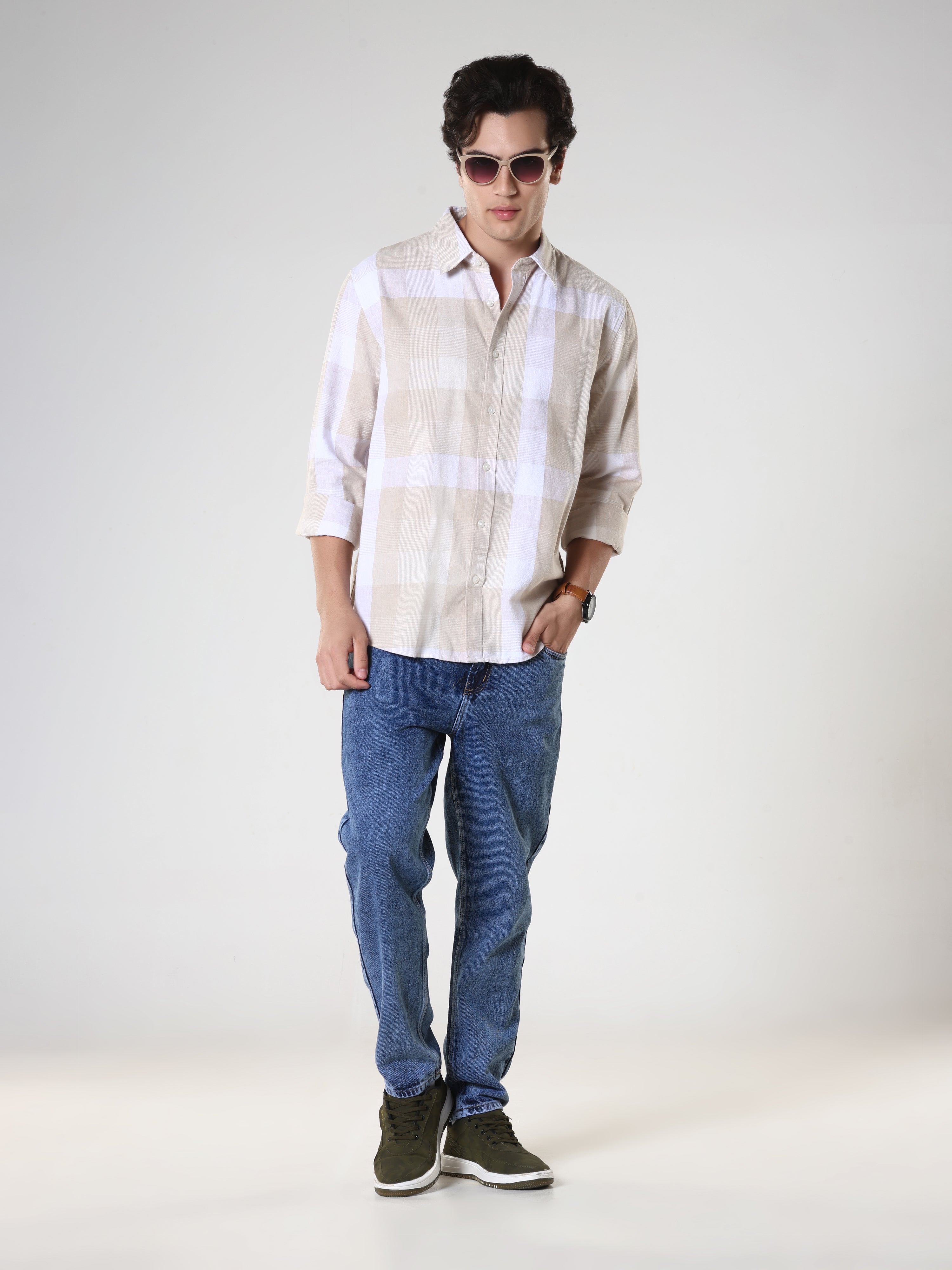 Men's casual beige checkered cotton shirt with full sleeves, relaxed fit – paired with denim jeans