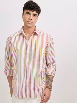 Man wearing a peach cotton oversized striped shirt with rolled sleeves, front pocket, and button-down collar
100% cotton

