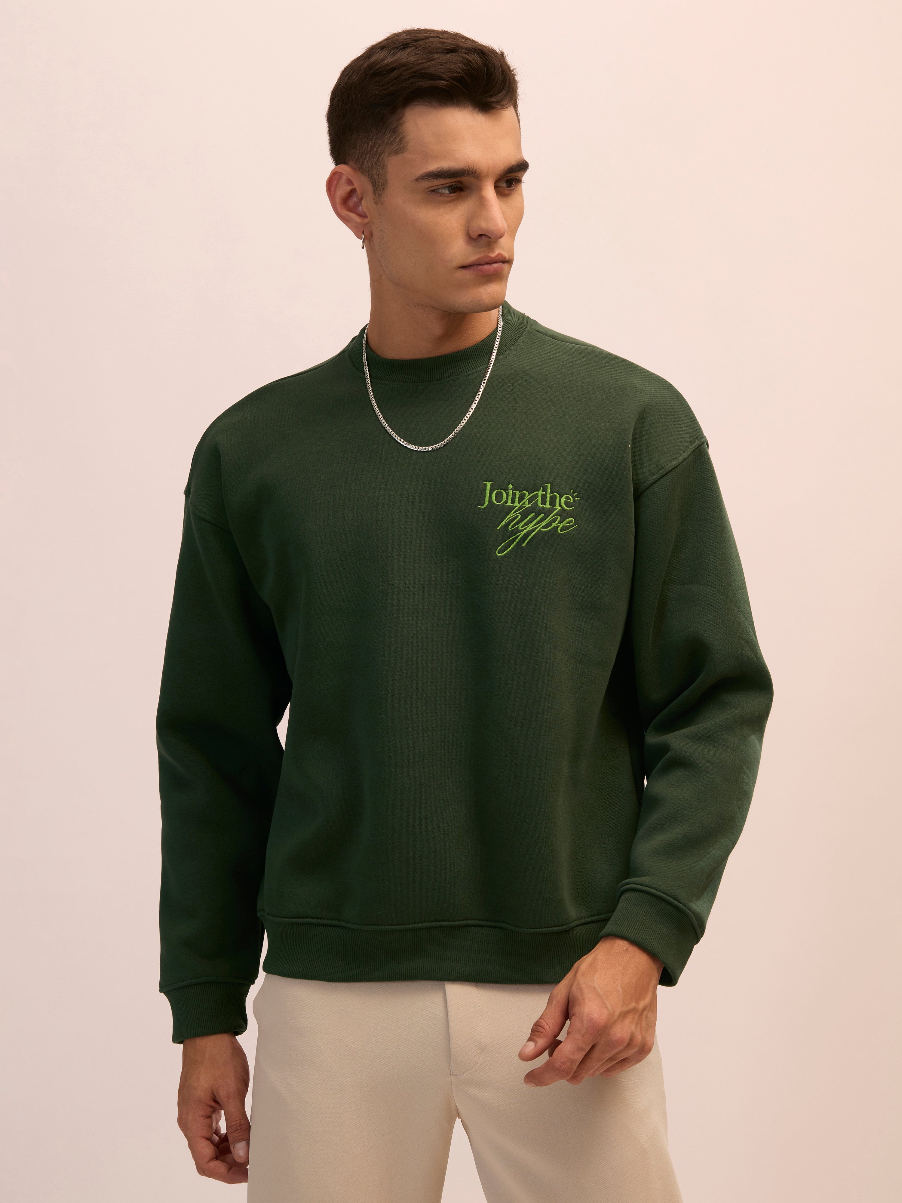 Men's forest green full sleeve fleece sweater tee with front chest print and soft winterwear.