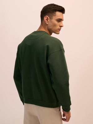 Men's forest green full sleeve fleece sweater tee with front chest print and soft winterwear.