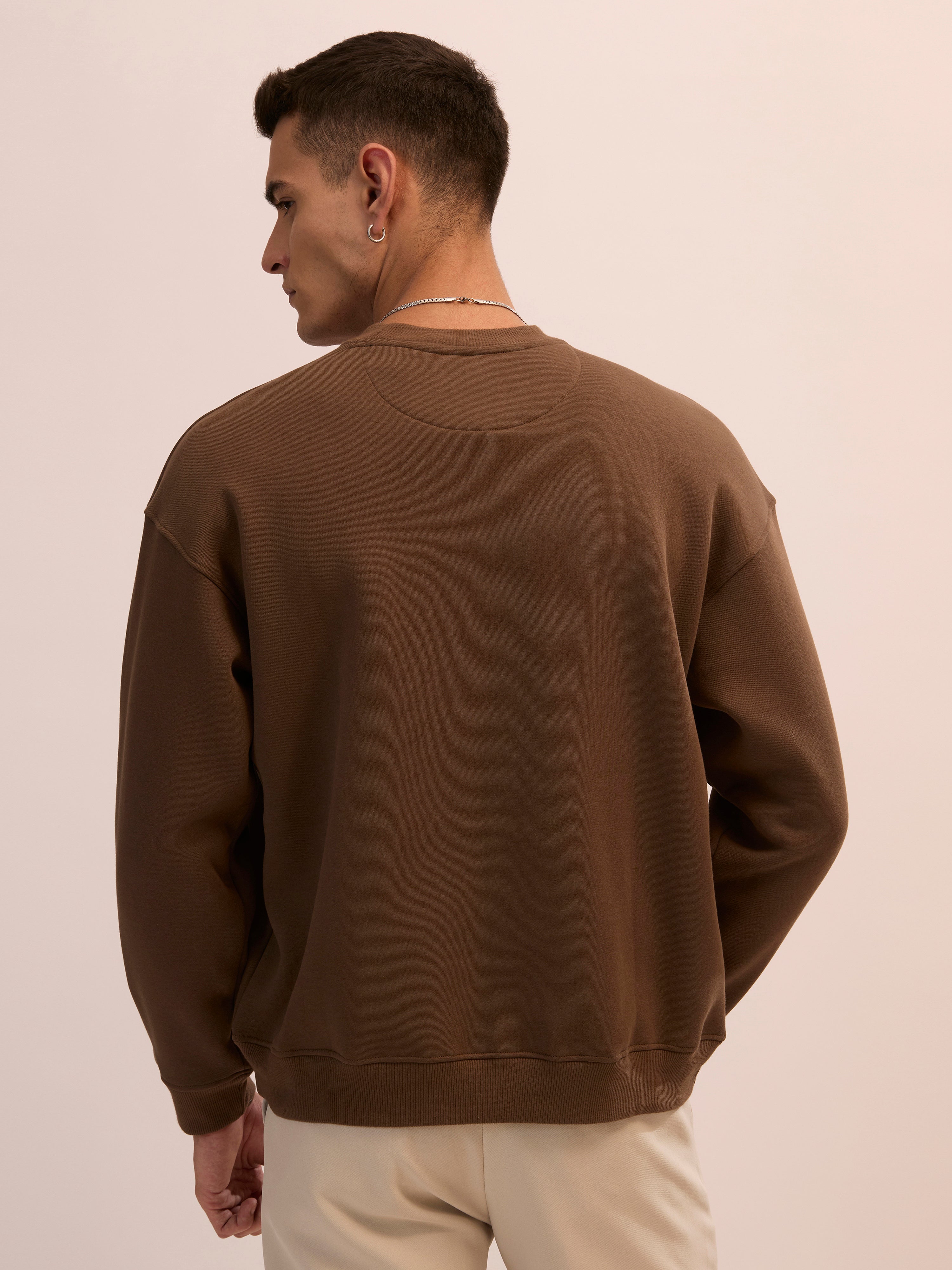 Men's choclate brown full sleeve fleece sweater tee with front chest print and soft winterwear.