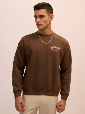 Men's choclate brown full sleeve fleece sweater tee with front chest print and soft winterwear.