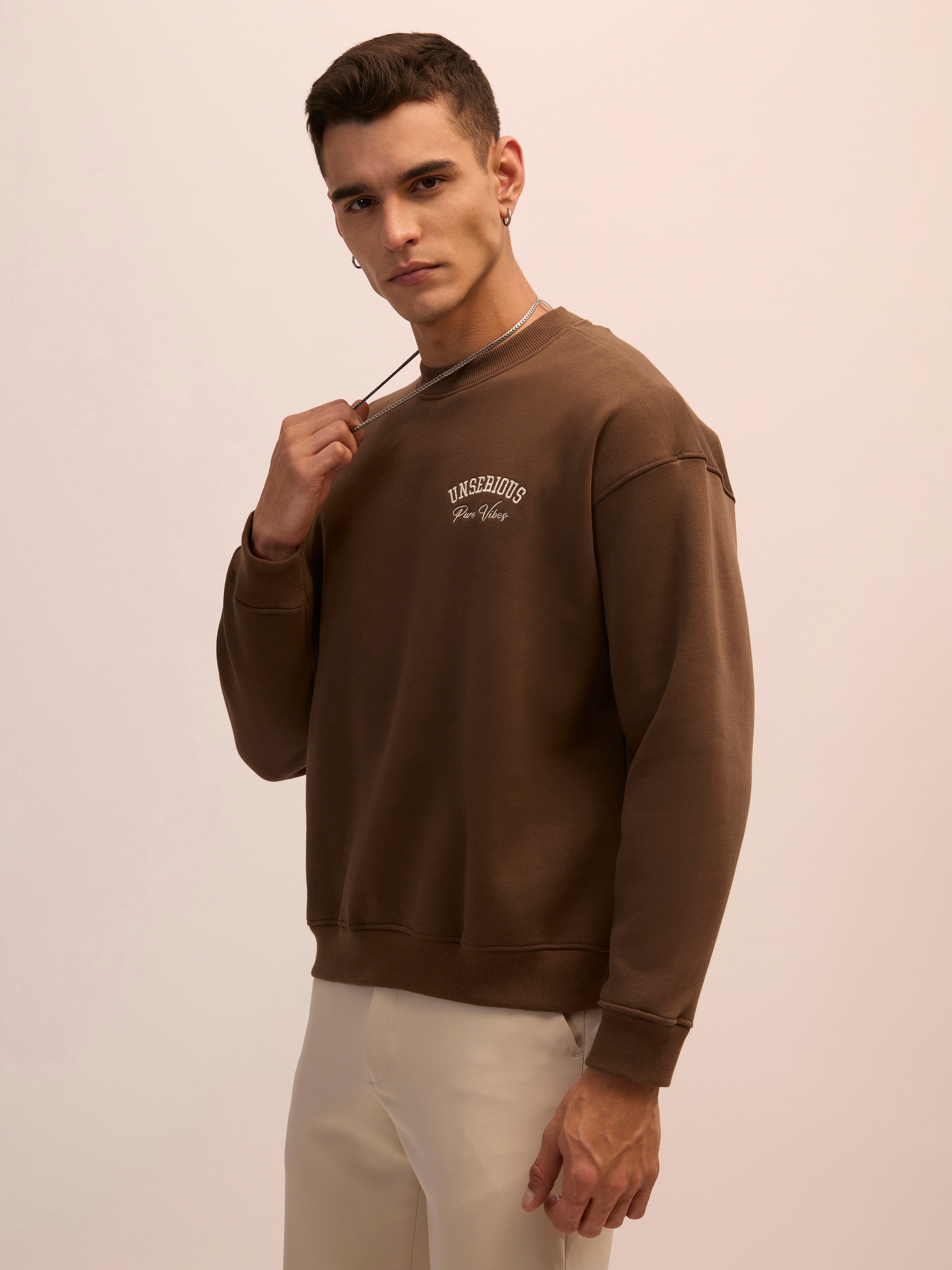 Men's choclate brown full sleeve fleece sweater tee with front chest print and soft winterwear.