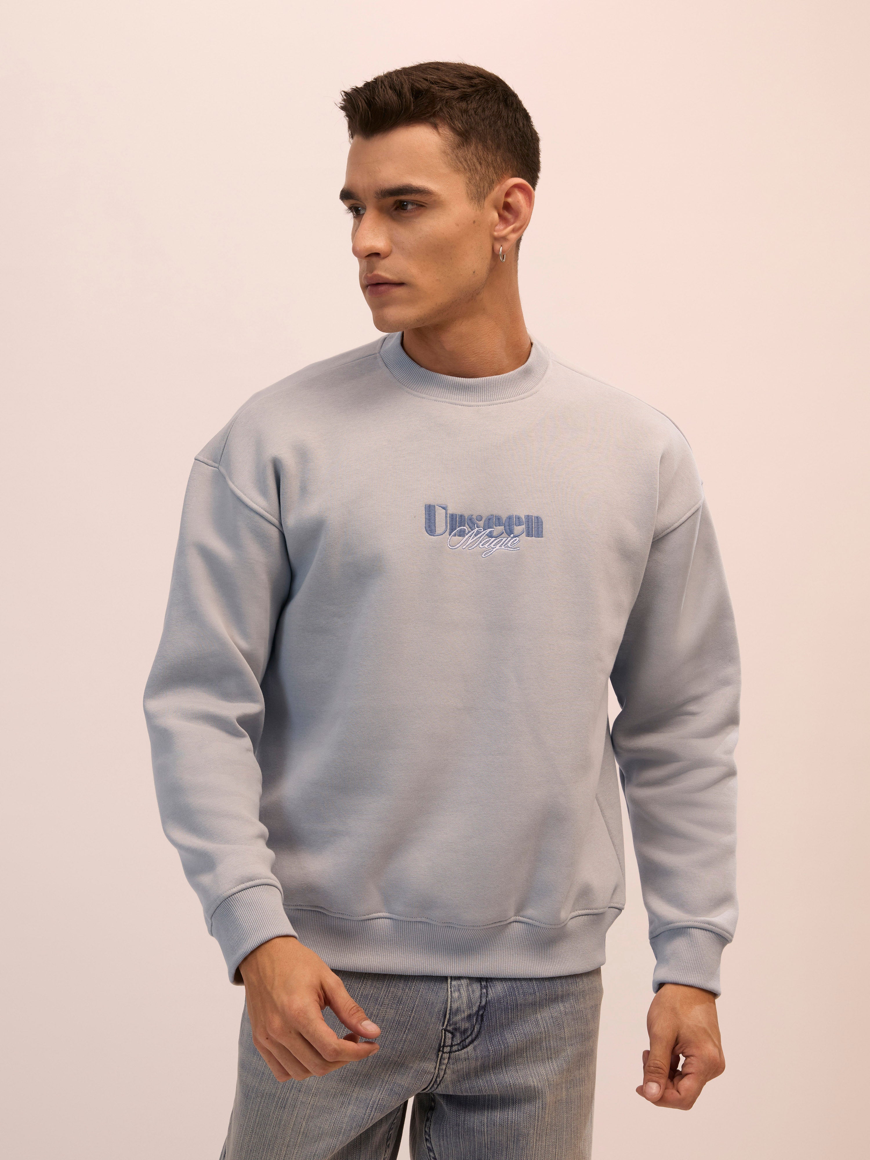 Men's sand gray full sleeve fleece sweater tee with front chest print and soft winterwear.