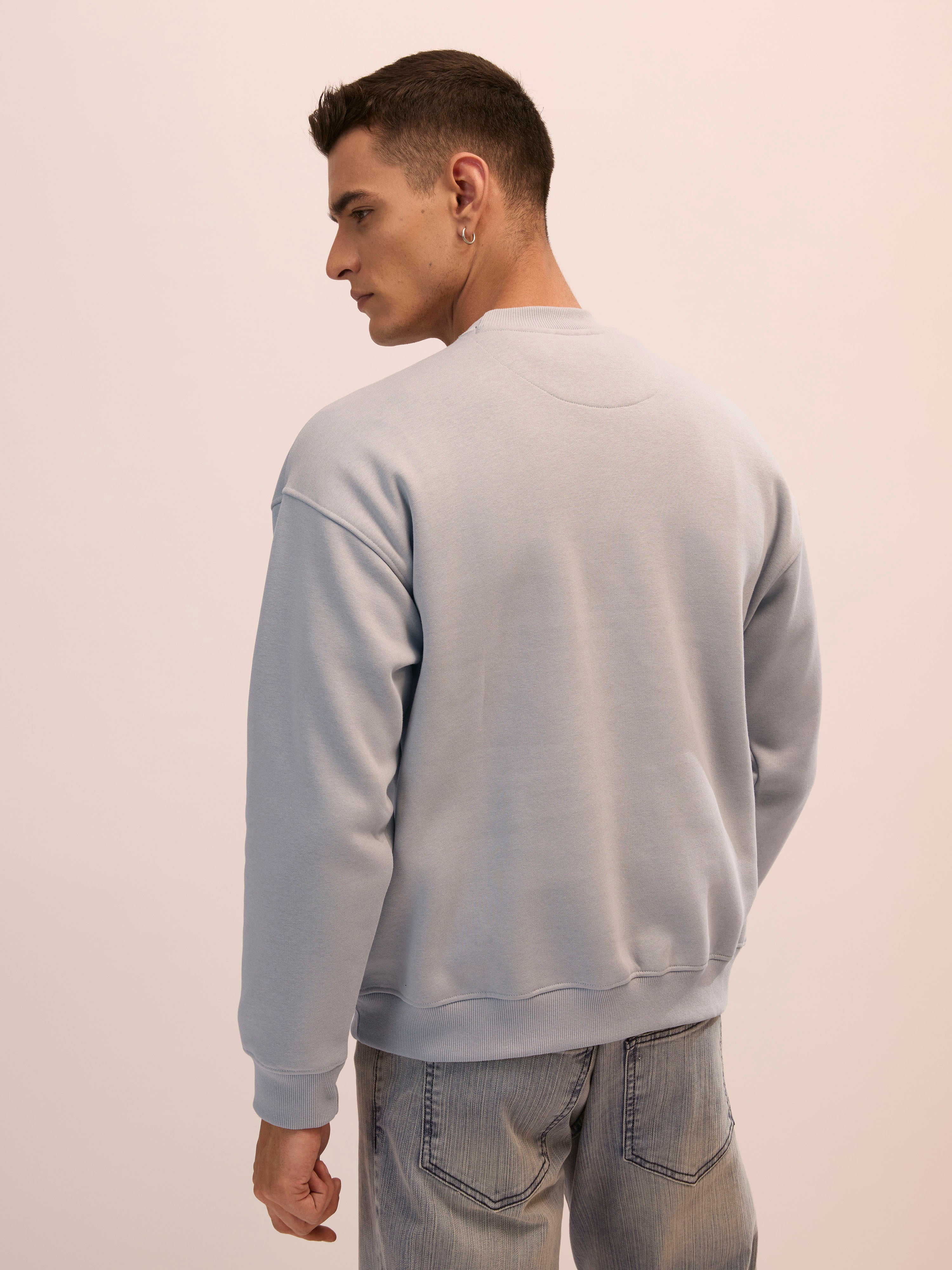 Men's sand gray full sleeve fleece sweater tee with front chest print and soft winterwear.