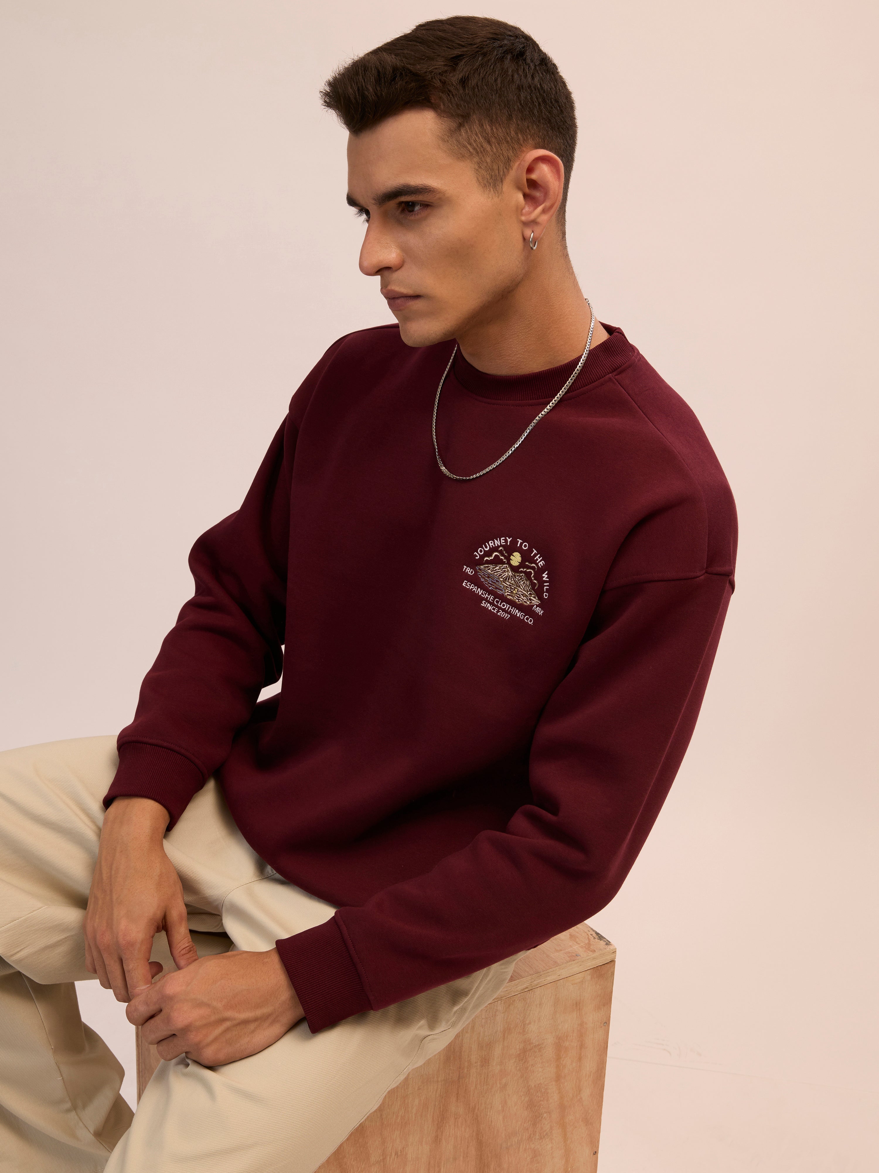 Men's maroon full sleeve fleece sweater tee with front chest print and soft winterwear.