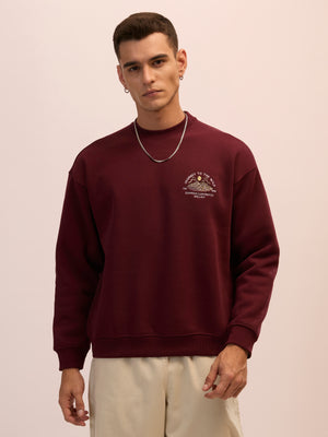 Men's maroon full sleeve fleece sweater tee with front chest print and soft winterwear.