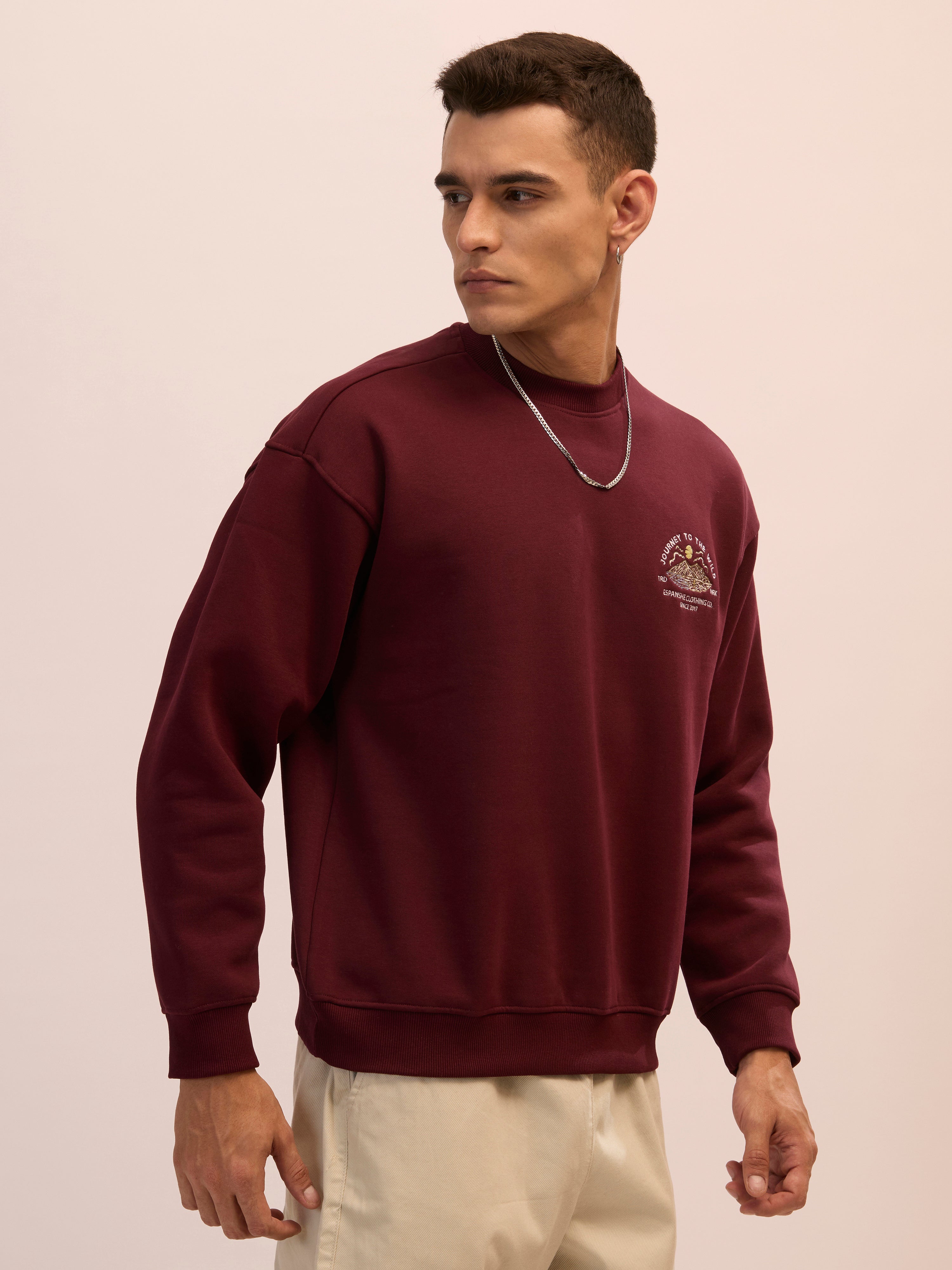 Men's maroon full sleeve fleece sweater tee with front chest print and soft winterwear.