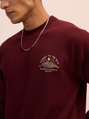 Men's maroon full sleeve fleece sweater tee with front chest print and soft winterwear.