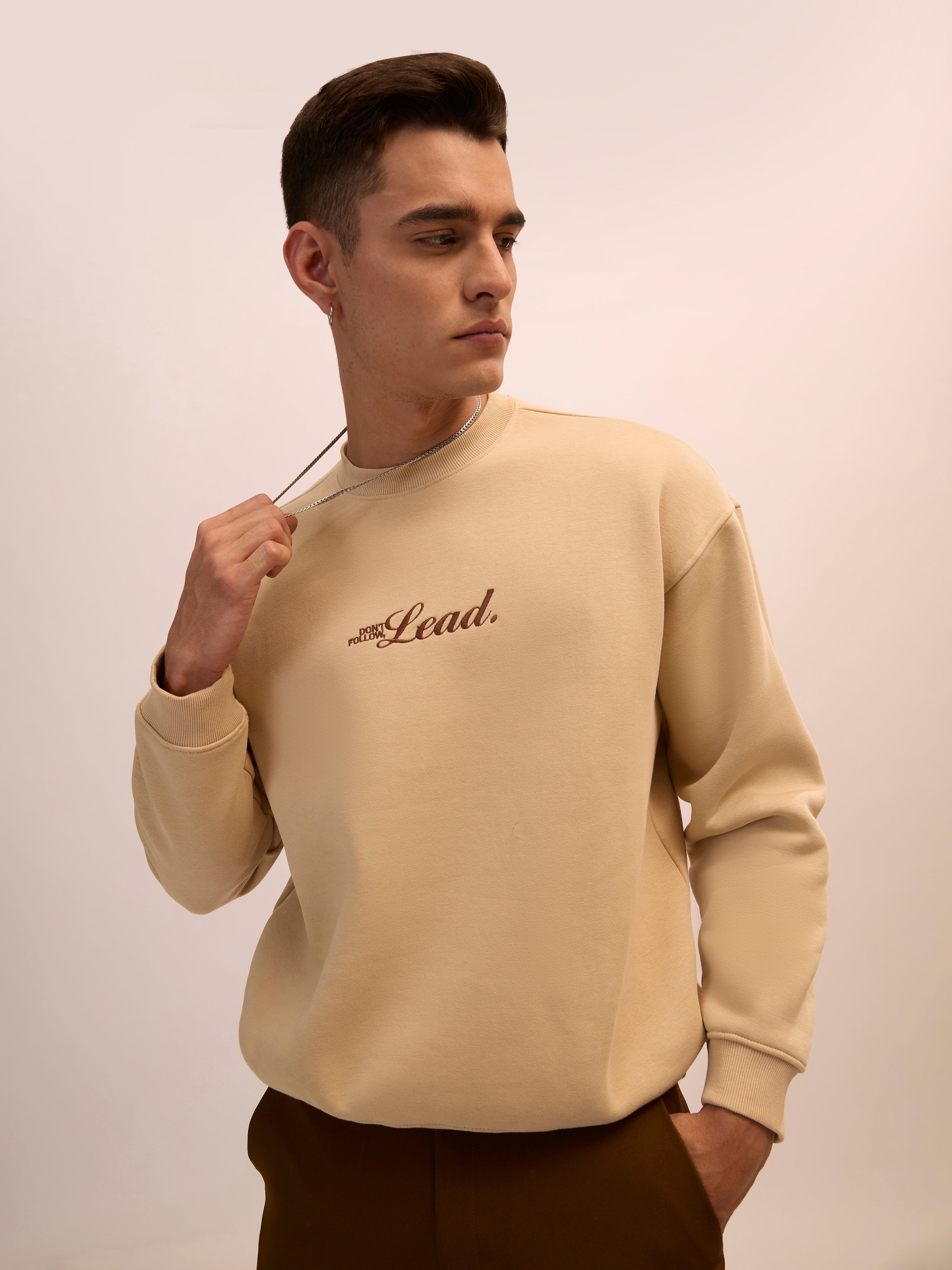 Men's camel beige  full sleeve fleece sweater tee with front chest print and soft winterwear.